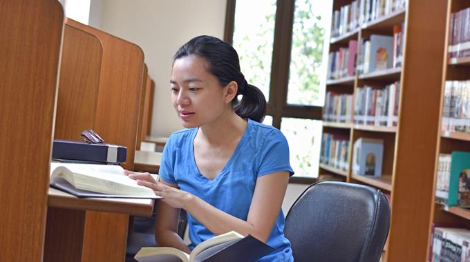 Woman studying in a library